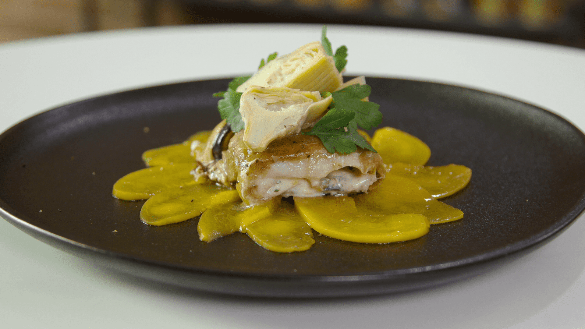 ROTOLINI DI MELANZANE E BRANZINO, CARPACCIO DI PESCHE E CREMOSO DI CAPRINO